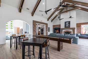 a games room with a shuffleboard table and a foosball table